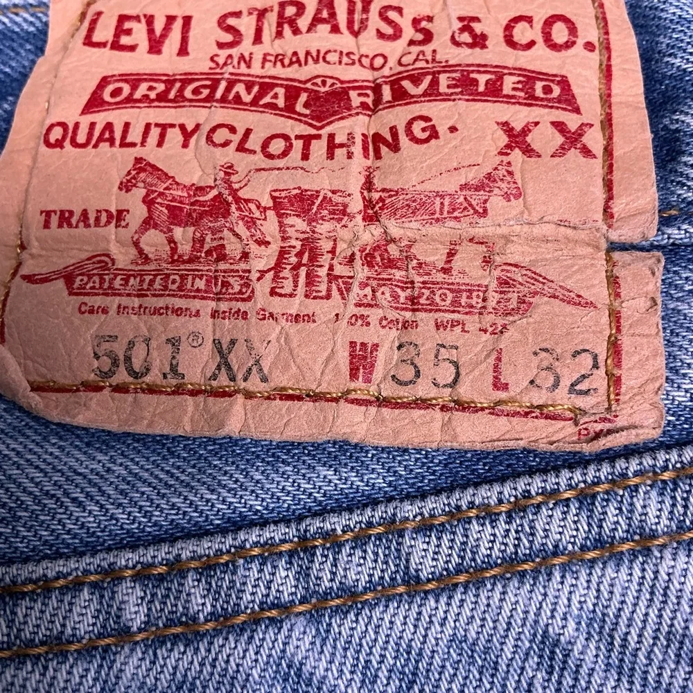 Vintage Levi’s 501XX button fly straight leg 90s medium wash jeans 34 x 29
